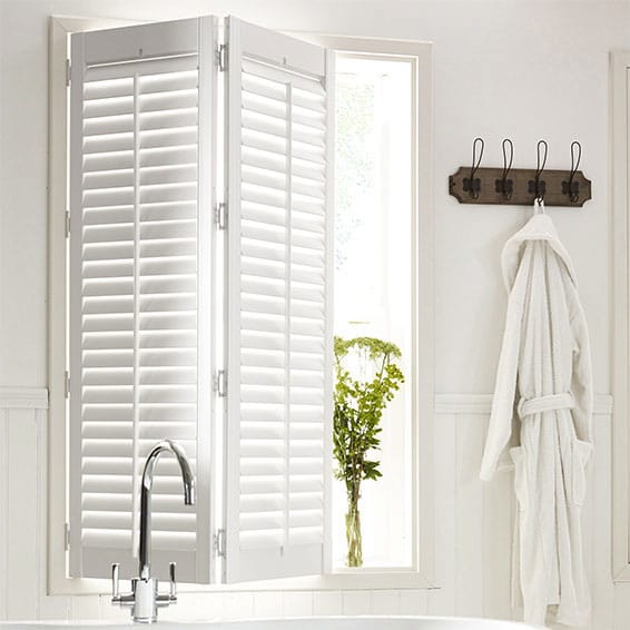white roomset with shutters in a modern bathroom